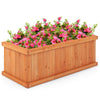 Raised wooden planter box with pink flowers, featuring 4 drainage holes and detachable bottom panels for versatile use.