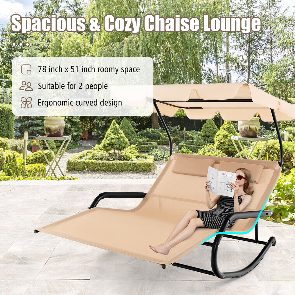 Spacious outdoor rocking chaise lounge for 2 with beige fabric, adjustable canopy, and wheels for easy movement.