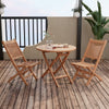Outdoor bistro set featuring slatted teak wood chairs and table, perfect for backyard or poolside relaxation.
