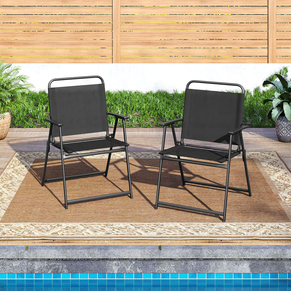 Set of 2 outdoor folding chairs with breathable seats and rustproof metal frames, perfect for backyard relaxation.