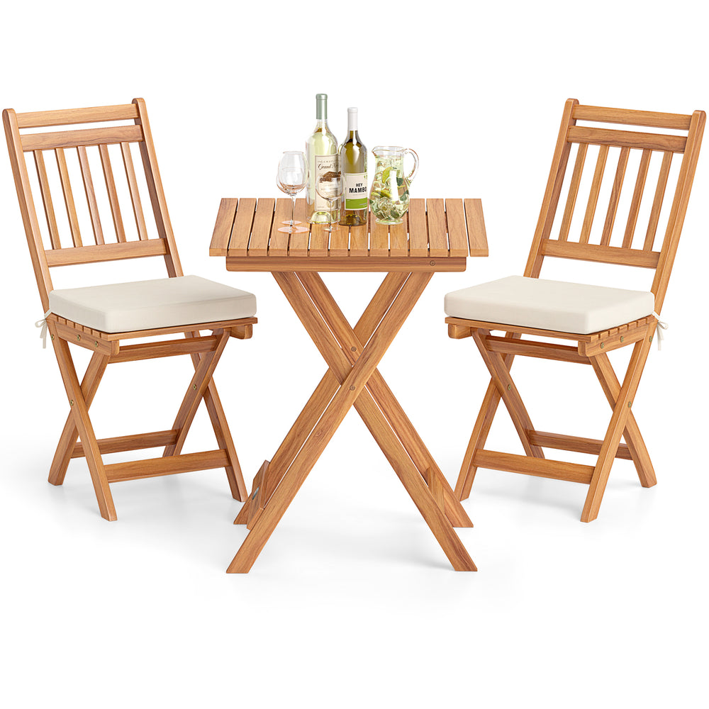Outdoor acacia wood bistro set with soft seat cushions, featuring a folding table and high-back chairs for backyard.