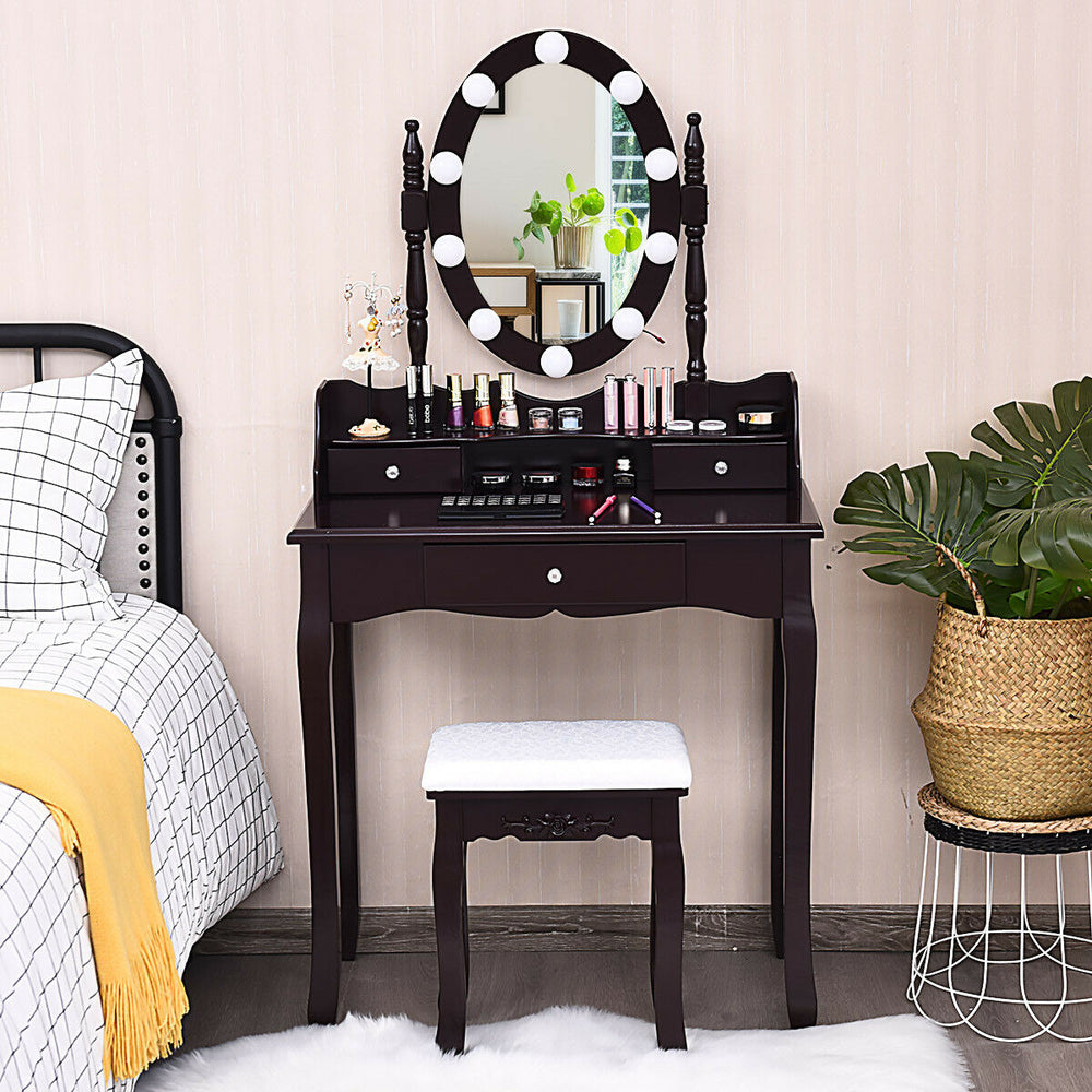 Brown oval mirror vanity set with 10 LED dimmable bulbs, 3 drawers, and soft cushion stool for cosmetics storage.