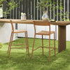 Light brown patio barstools with rattan seats and metal backrests, ideal for backyard or poolside relaxation.