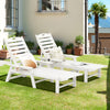 White patio chaise lounge chairs with adjustable backrests, perfect for poolside or backyard relaxation.