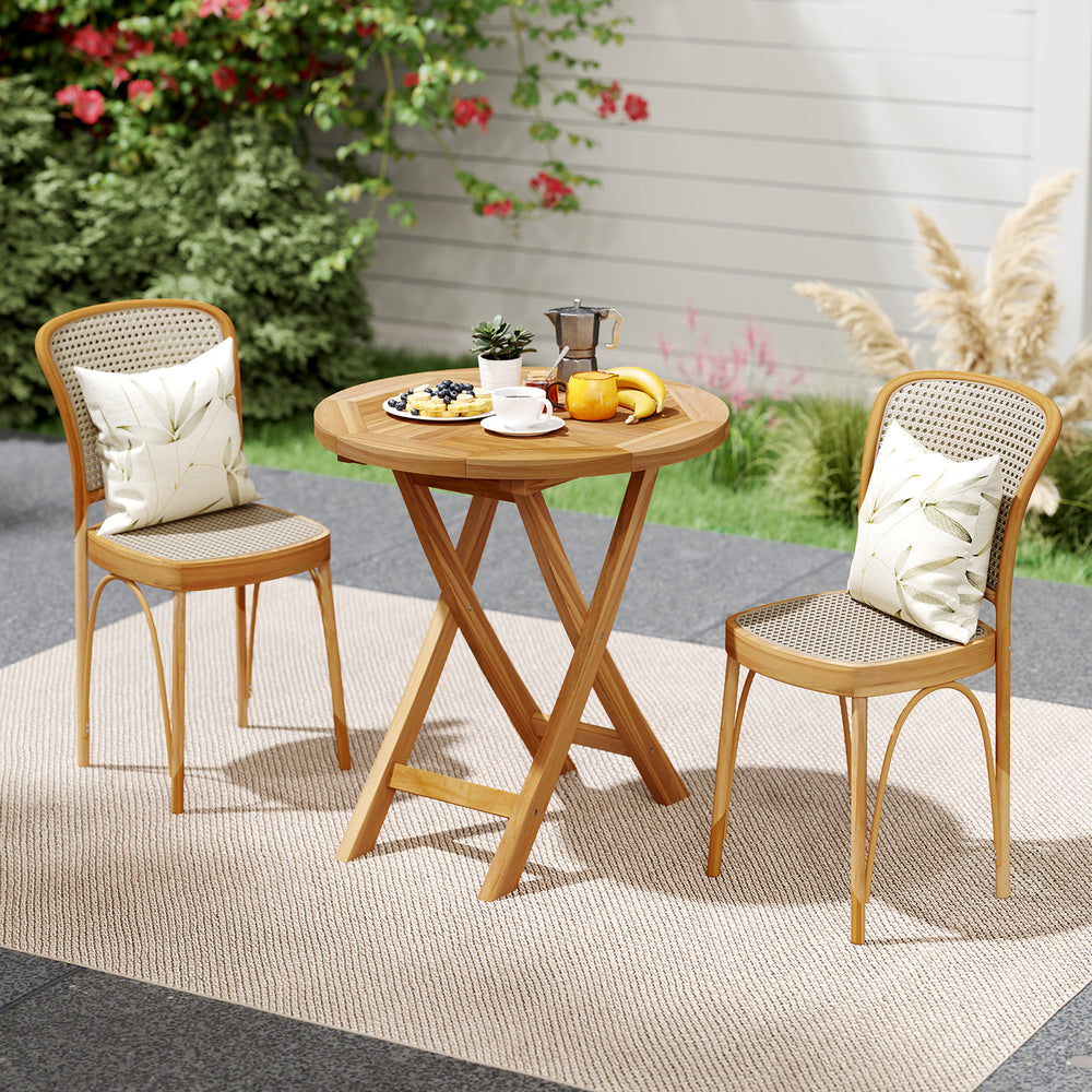 Teak wood dining table with slatted top and X-shaped frame, perfect for outdoor patio dining and relaxation.