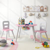 Kids activity table and chair set in pink with central mesh storage, perfect for playtime and homework in a child's.