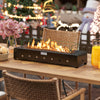 Portable mini fireplace with wind guard and stainless steel burner, providing 40,000 BTU heat for outdoor tables.