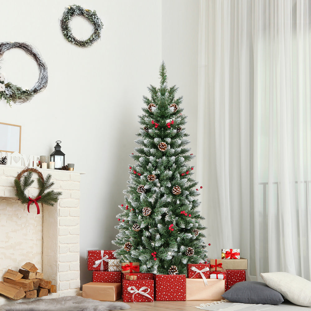 5-foot pre-lit artificial Christmas tree with pine cones and red berries, decorated with 250 warm white LED lights.