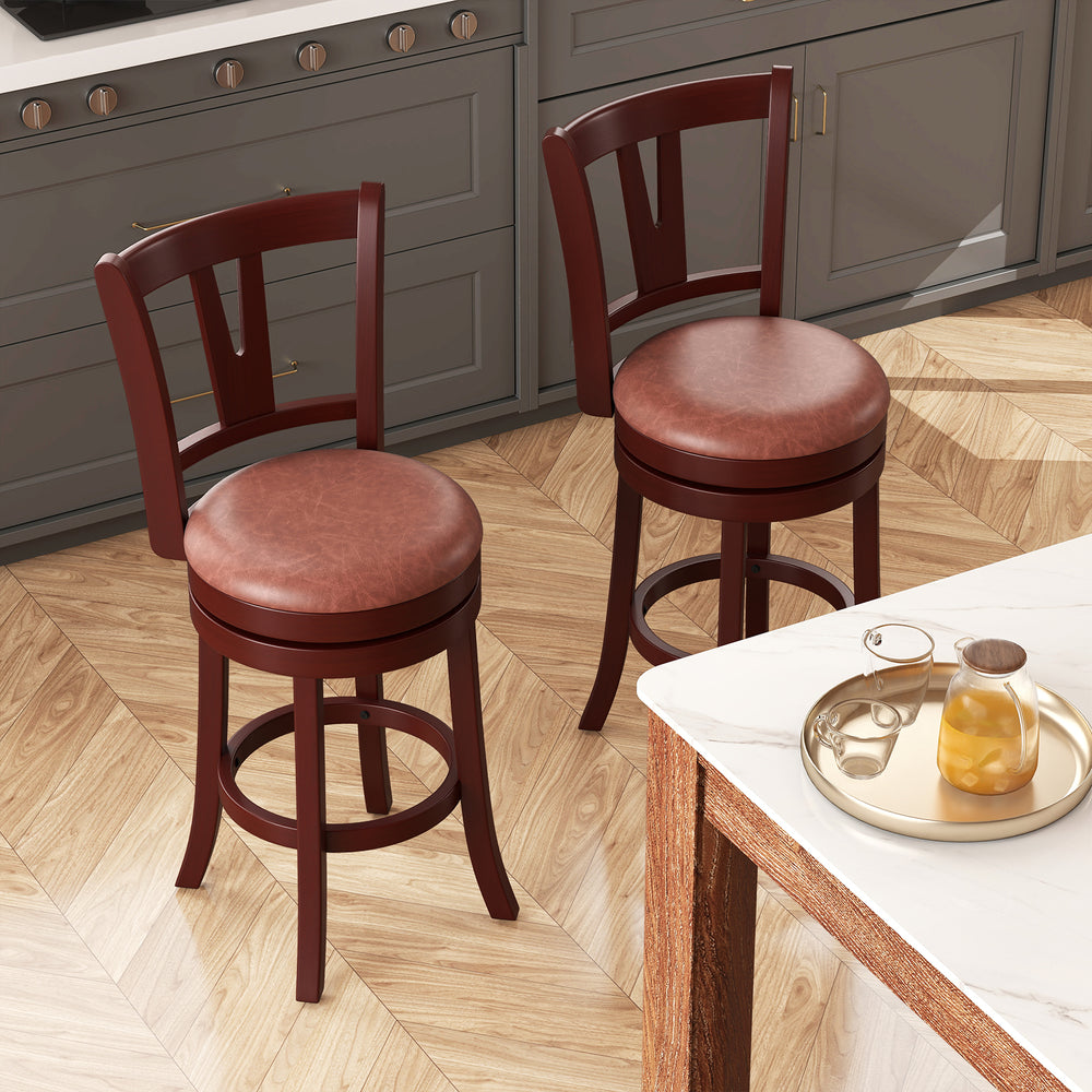 Set of 2 counter height swivel barstools with high backs, faux leather seats, and built-in footrests for kitchen.