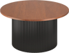 Round coffee table with walnut wooden top and wave-shaped black support, perfect for versatile room settings.