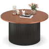 Round coffee table with 32" walnut wooden top and unique wave-shaped black base, designed for stability and elegance.