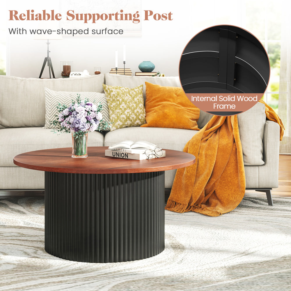 Round coffee table with walnut wooden top and wave-shaped support post, offering ample storage and stability for any.
