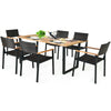 7-piece outdoor dining set featuring a large acacia wood table and weather-resistant rattan chairs for garden use.