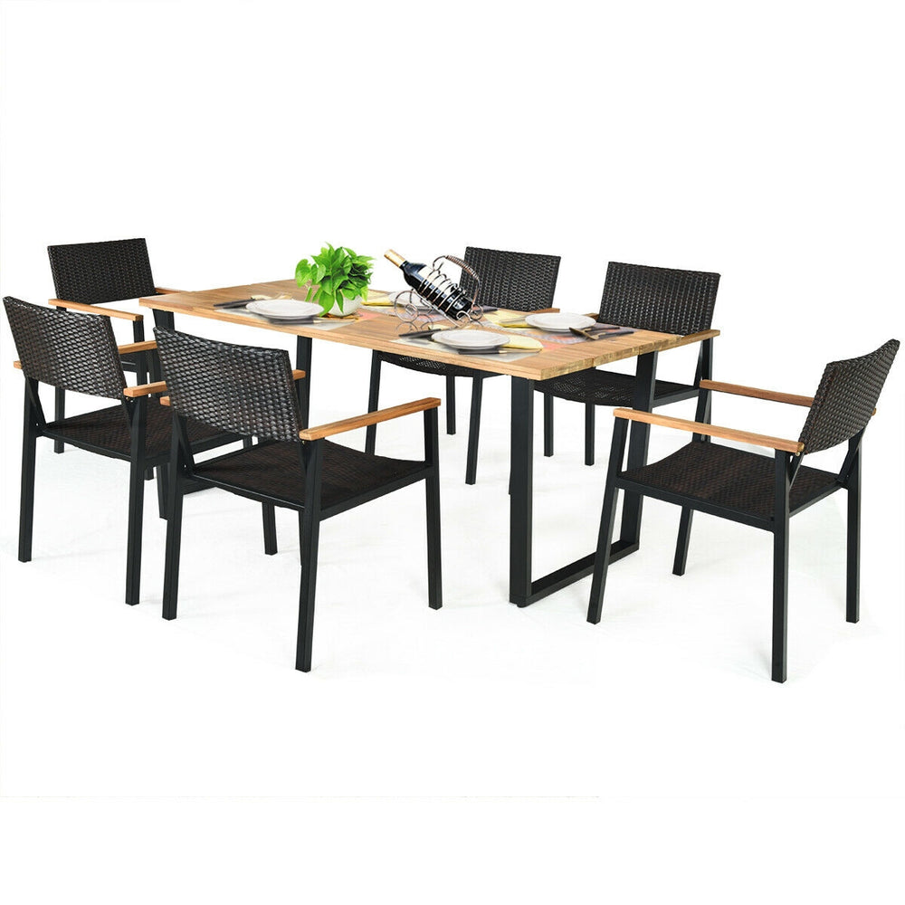 7-piece outdoor dining set featuring a large acacia wood table and weather-resistant rattan chairs for garden use.
