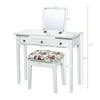 Vanity dressing table set with flip top mirror, three drawers, and floral cushioned stool for compact spaces.