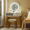 Makeup dressing table with lighted round mirror, 4 drawers, and solid beech wood legs for elegant bedroom decor.