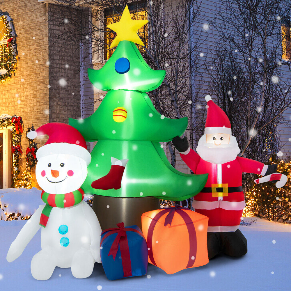 Close-up of the inflatable snowman in a festive scarf beside the 7.2 feet Christmas tree, enhancing holiday cheer.