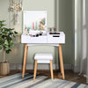 Wooden vanity table with flip top mirror and cushioned stool, featuring elegant design and ample storage for makeup.