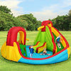 Brightly colored inflatable water slide bounce house with climbing wall and splash pool for kids aged 3-10.