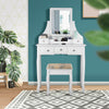 White makeup dressing vanity set with 5 drawers, removable top, and padded stool for comfortable use in any room.