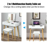 Wooden vanity table with flip top mirror and cushioned stool, versatile for makeup or as a writing desk, elegant white.