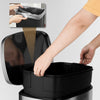 Stainless steel 13.2-gallon trash can with a removable bucket and easy-lift handles for convenient waste disposal.