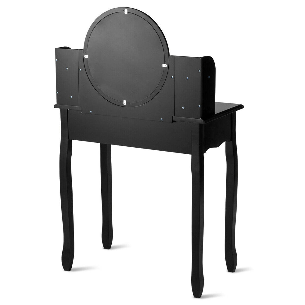 Black makeup vanity table set featuring an oval mirror, four drawers, and a cushioned stool for stylish storage and.