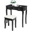Black vanity dressing table with cushioned stool, featuring 5 drawers and adjustable brightness for cosmetics storage.
