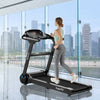 Folding treadmill with a 2.25HP motor and wide running belt, featuring a Bluetooth speaker for an enhanced workout.
