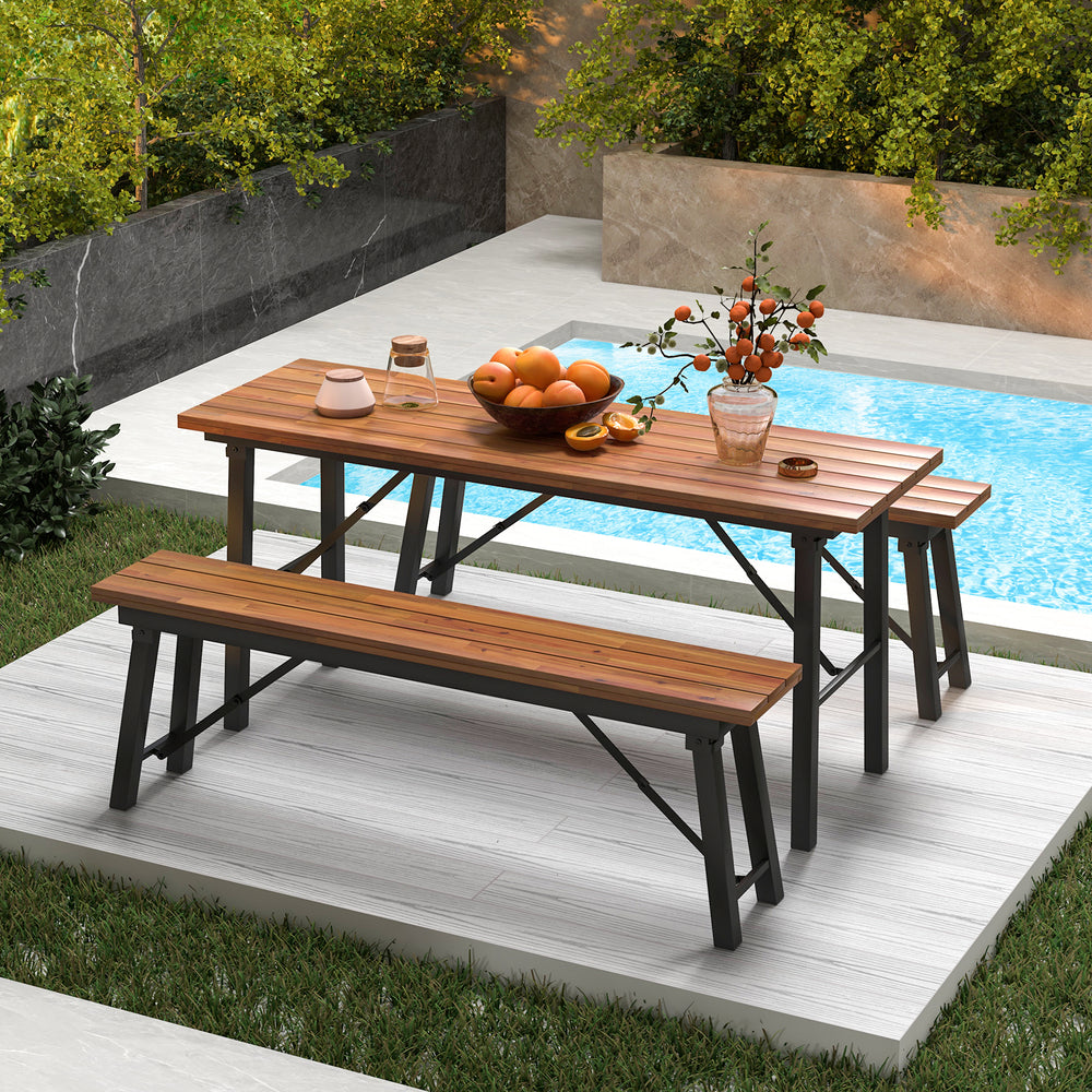 Outdoor dining table and bench set with acacia wood top, perfect for garden or poolside gatherings.