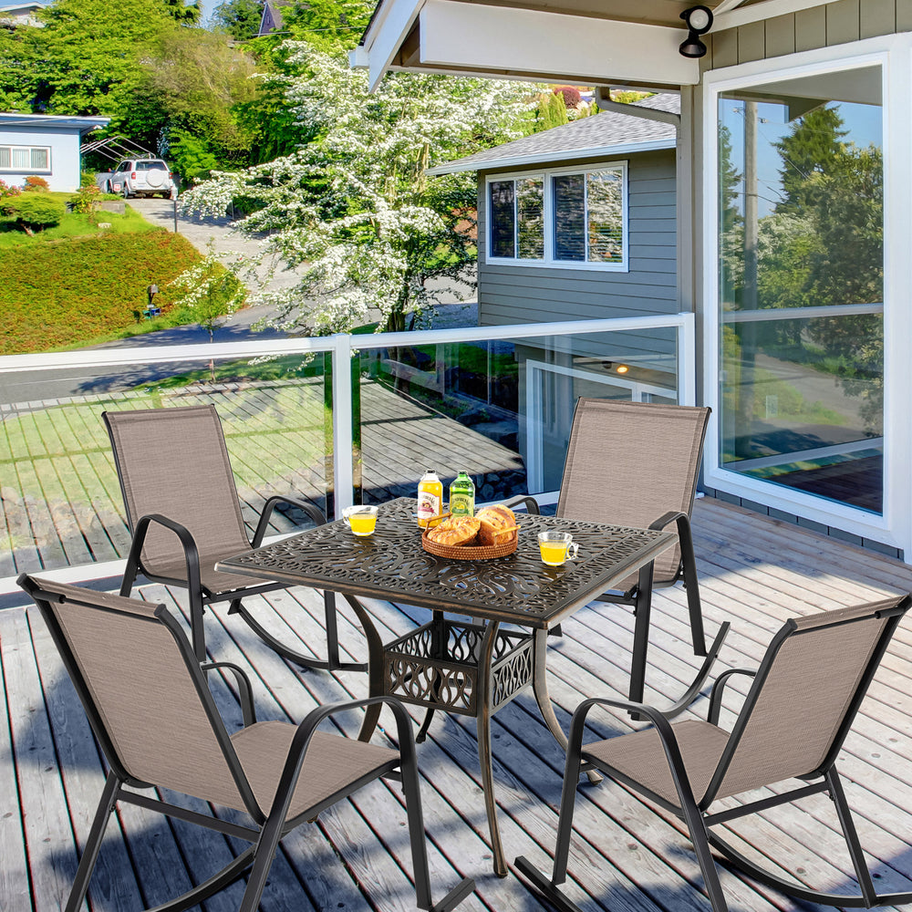Set of 2 heavy-duty metal patio rocking chairs with breathable brown fabric, perfect for backyard relaxation.