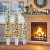 Set of 3 pre-lit snow flocked artificial Christmas trees in metal pots, featuring warm white LED lights for festive.