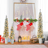 Set of 3 pre-lit snow flocked artificial Christmas trees with warm white LED lights for festive holiday decor.