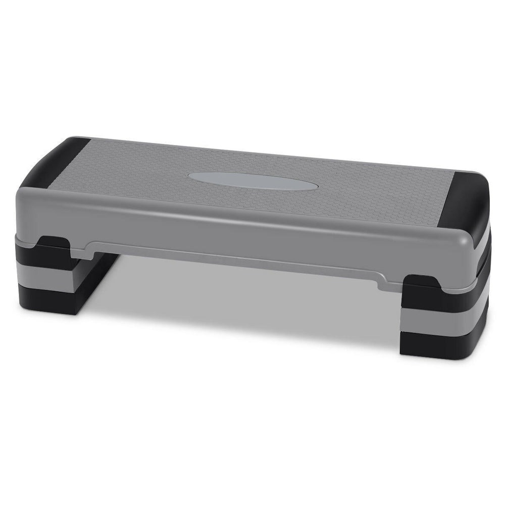 Adjustable 35-inch aerobic cardio stepper with risers, featuring a non-slip surface for home or workout classes.