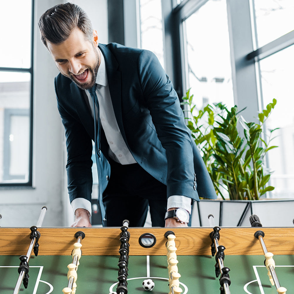 Competition-sized 48" wooden foosball table with sturdy legs and non-slip handles, perfect for game rooms and offices.