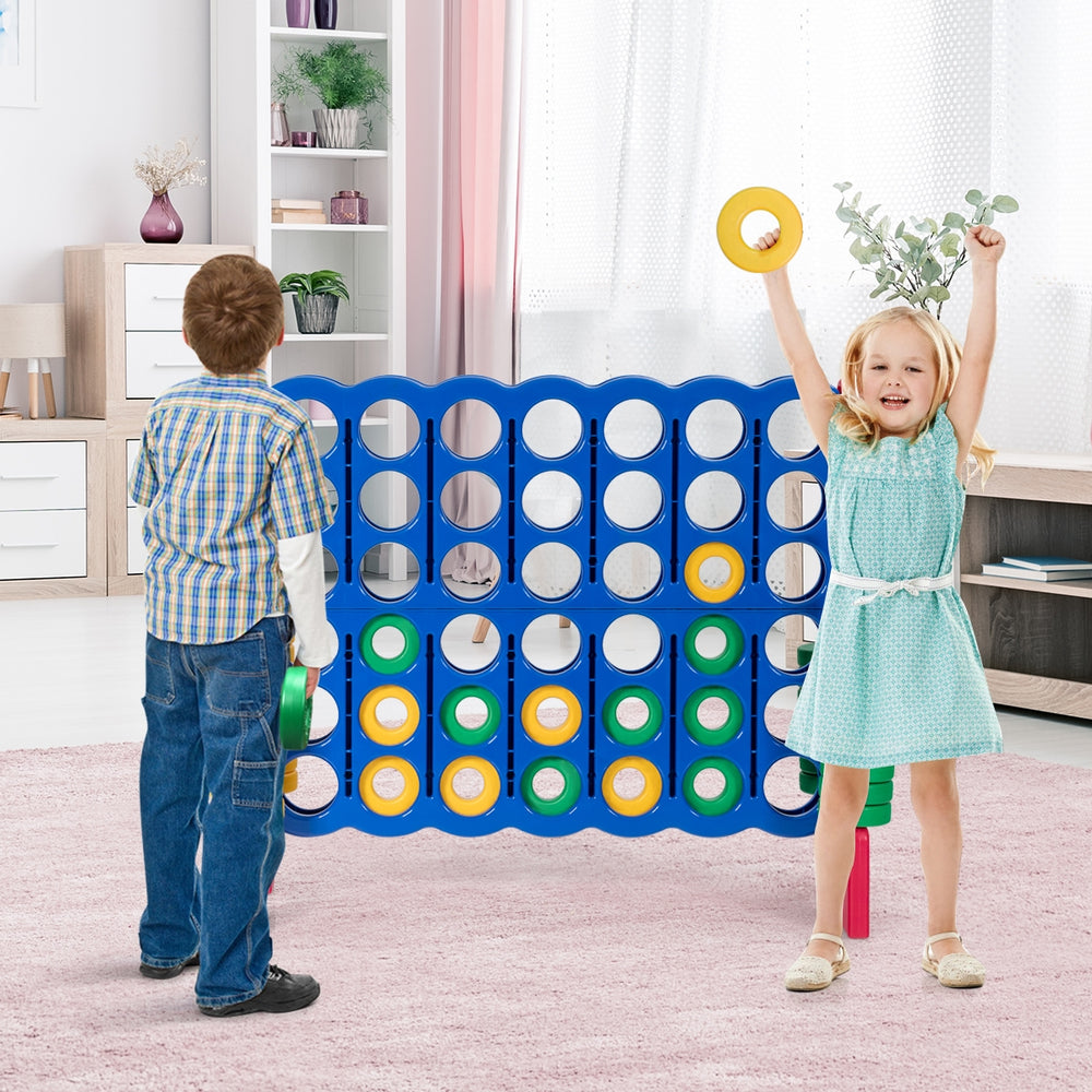 Children playing with the Jumbo 4-to-Score Giant Game Set, featuring 42 colorful rings for outdoor fun and skill.