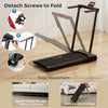 Folding treadmill with large desk and LCD display, showcasing easy movement with built-in wheels for convenient storage.