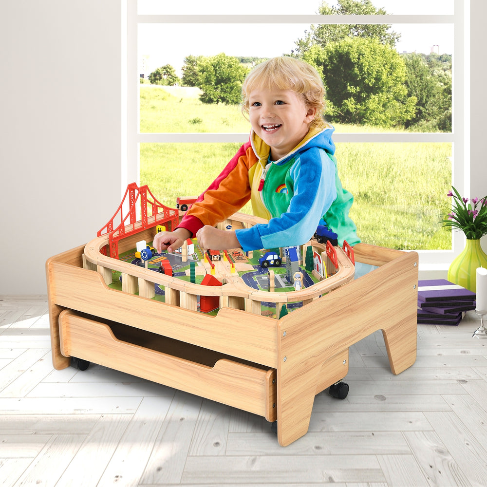 Kids Wooden Train Set Table featuring 100 colorful pieces, lockable wheels, and sturdy legs for imaginative play.