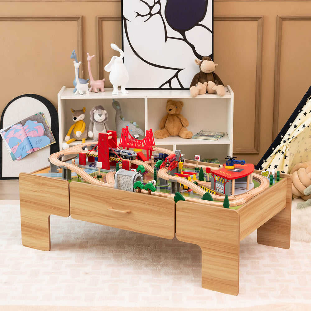 Double-sided wooden train set table with 100 pieces, featuring storage drawer and imaginative play accessories for kids.