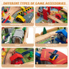 Wooden train set accessories including vehicles, signs, houses, and figures for imaginative play and town building.