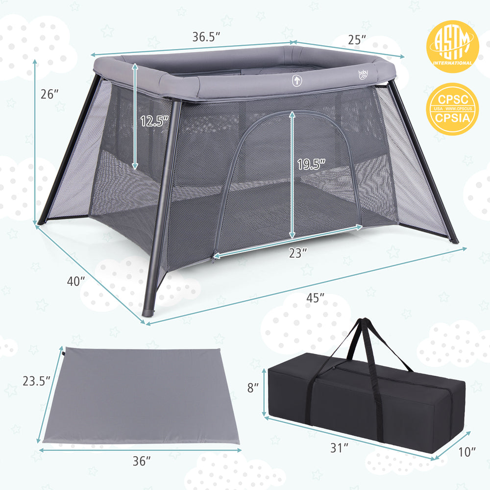 Portable baby playpen in dark gray with safety enclosure, padded mattress, and compact carrying bag for easy transport.