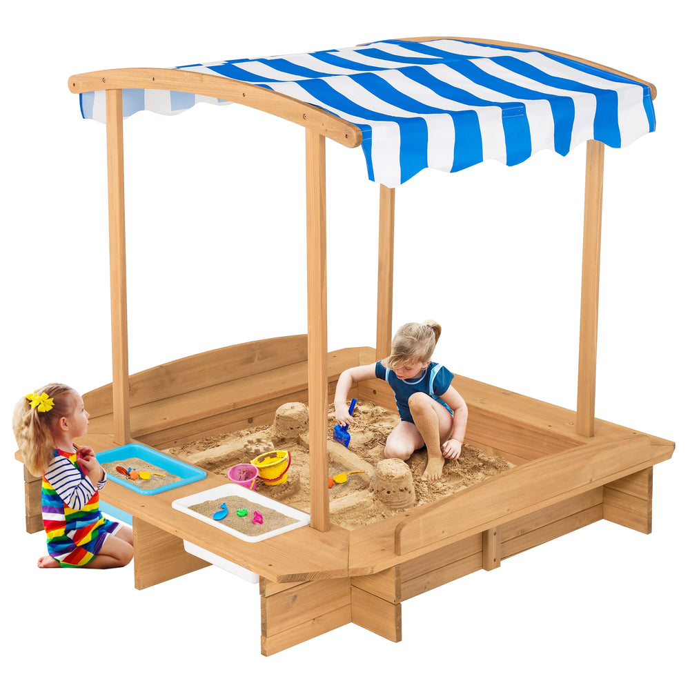 Kids wooden sandbox with striped canopy, made of solid cedar wood, featuring seating and plastic bins for sand and.