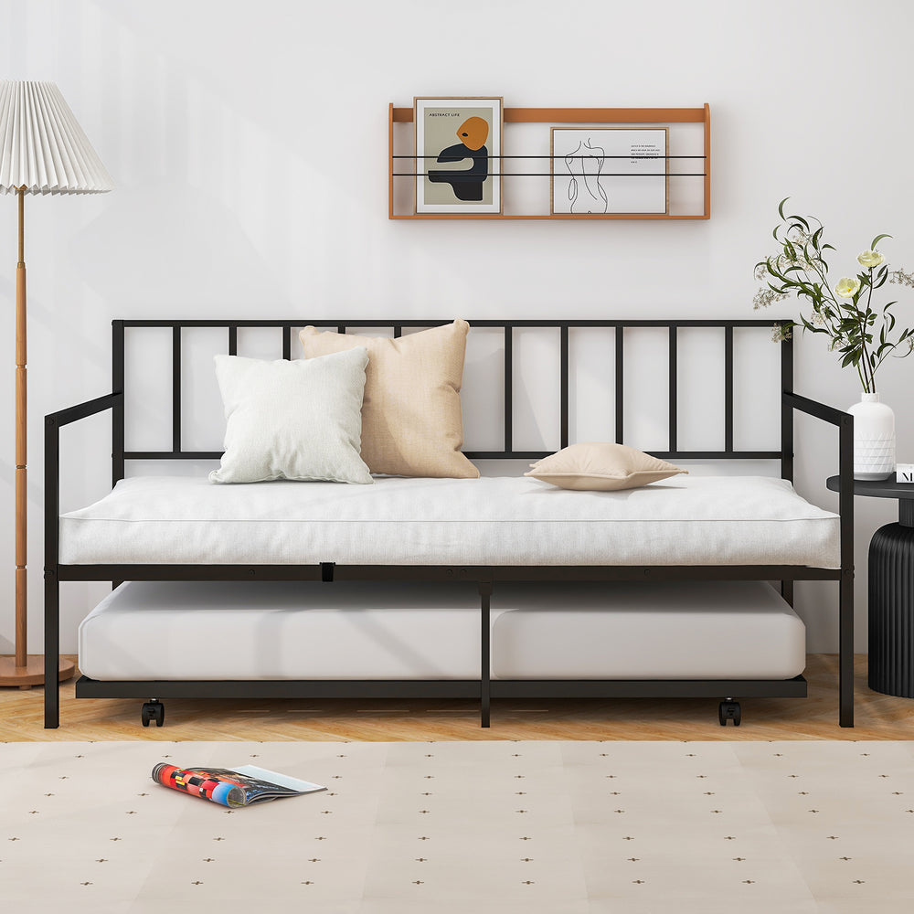 Twin size daybed and trundle frame set in black with cushions, ideal for living room or guest room use.