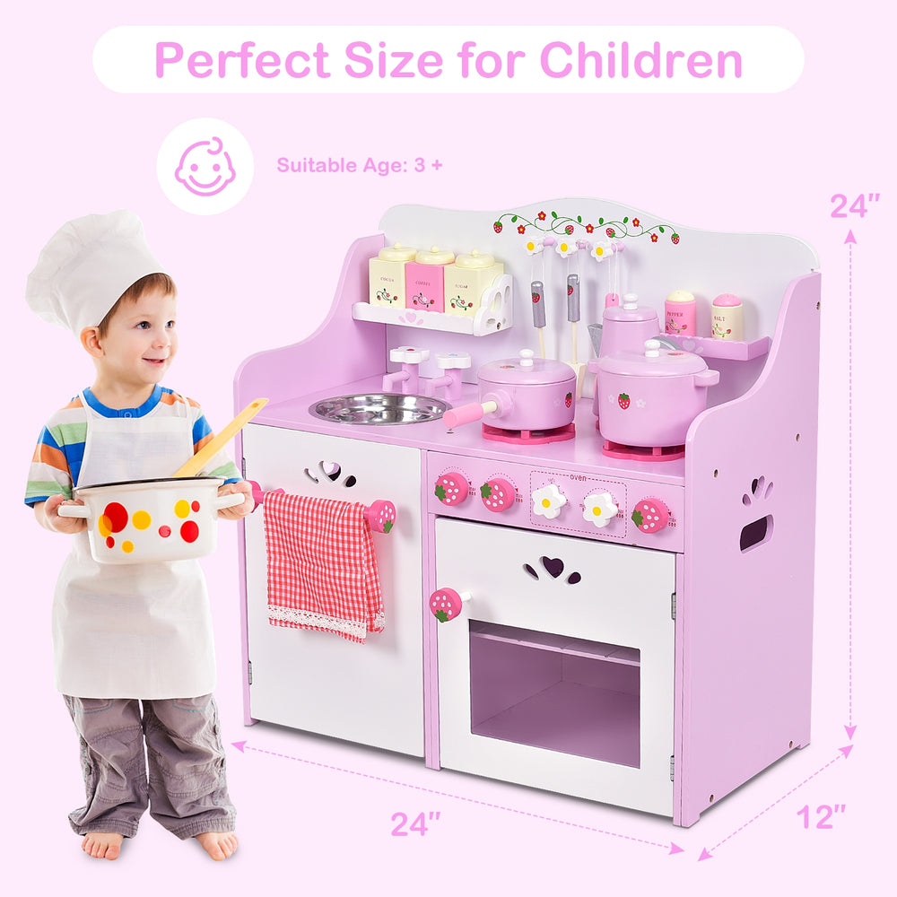 Kids wooden kitchen toy playset in pink with strawberry design, featuring realistic details and storage space for.