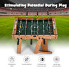 Foldable table football with durable handle, scoreboard, and two footballs for safe, fun play and skill development.