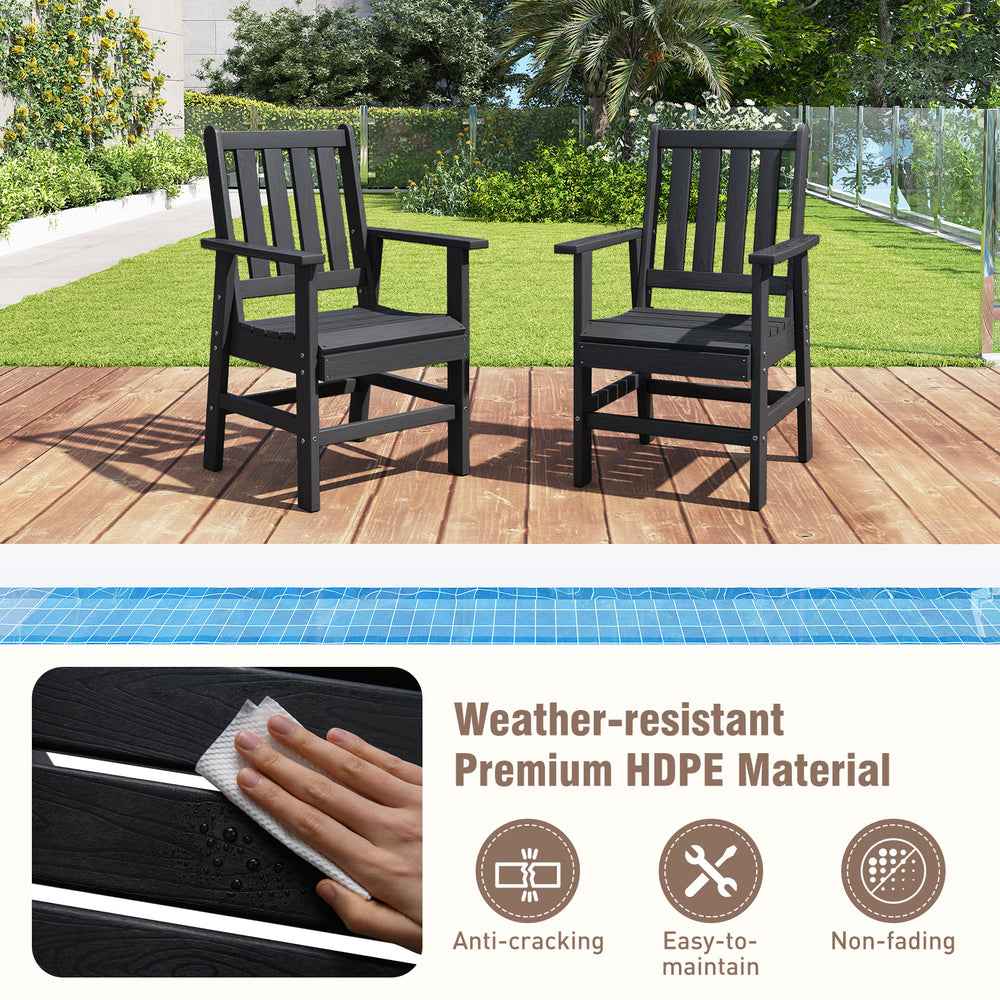 Two black HDPE patio chairs with armrests on a wooden deck, perfect for outdoor dining and relaxation.