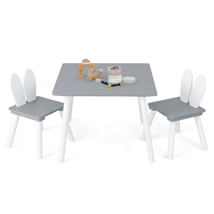 Multifunctional kids' table and chairs set with bunny ear backrests, perfect for drawing and eating in a playful design.
