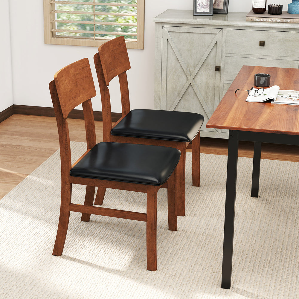 Set of 2 dining chairs with rubber wood legs and black faux leather seats, perfect for kitchen or dining room use.