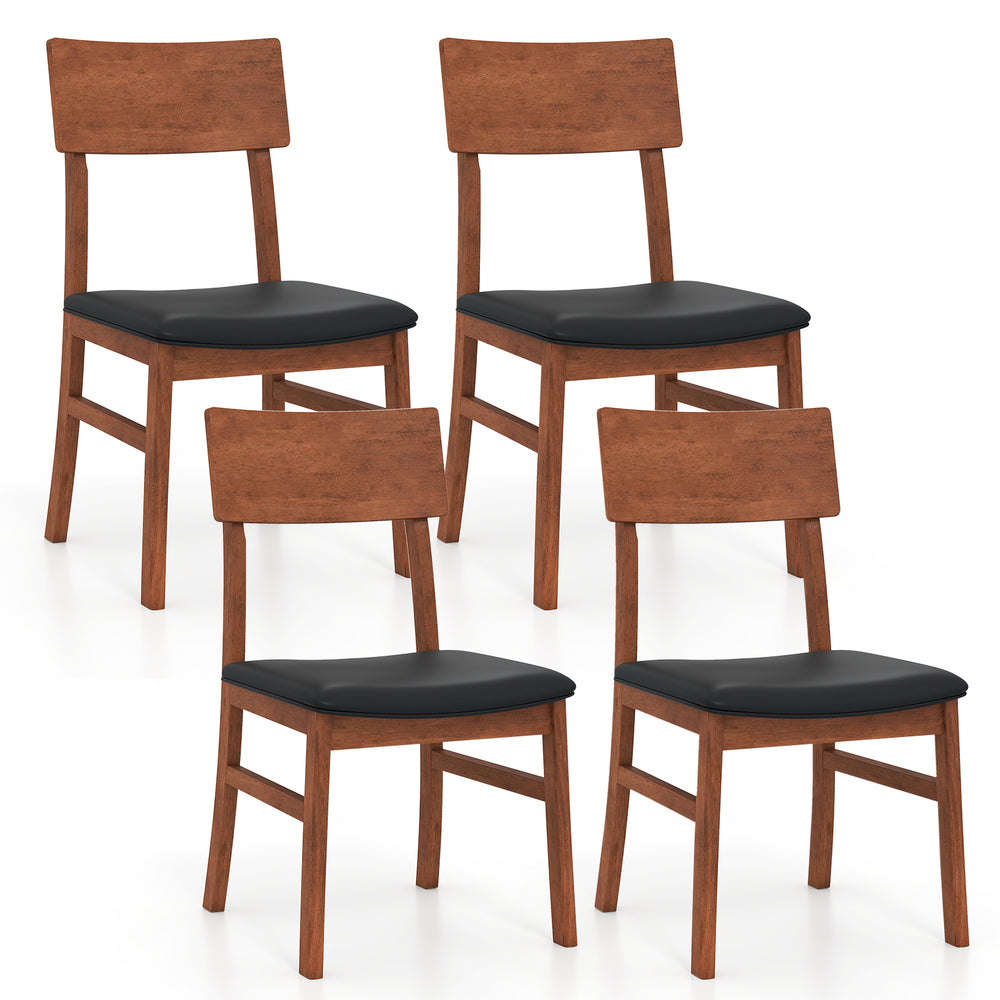 Set of four dining chairs with rubber wood legs and black faux leather upholstered seats, ideal for kitchen or dining.