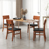 Set of 2 dining chairs with rubber wood legs and black faux leather seats, ideal for kitchen or dining room use.